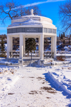 A small white building with a dome on top. The building is surrounded by snowの写真素材