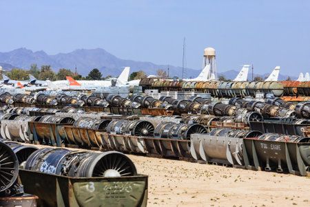 A large pile of old airplane parts sit in a field. The scene is desolate and abandoned, with no signs of life or activity. The planes are old and rustedの写真素材