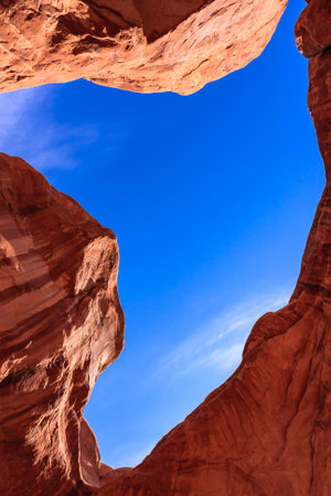 The sky is blue and the sun is shining. The canyon is full of rocks and the sky is clearの写真素材