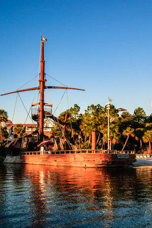 A large ship is sailing on the water with a bright blue sky in the background. The scene is peaceful and serene, with the ship being the main focus of the imageの写真素材