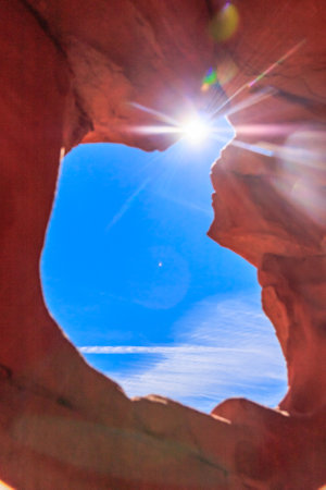 The Valley of Fire derives its name from red sandstone formations, formed from great shifting sand dunes during the age of dinosaurs. Complex uplifting and faulting of the region, followed by extensive erosion, have created the present landscape.の写真素材
