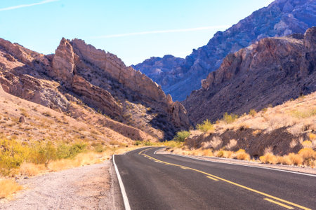 The Valley of Fire derives its name from red sandstone formations, formed from great shifting sand dunes during the age of dinosaurs. Complex uplifting and faulting of the region, followed by extensive erosion, have created the present landscape.の写真素材
