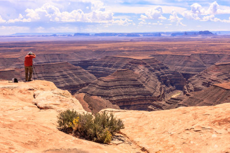 Muley Point is a remote, scenic overlook in southern Utah. Monument Valley is visible in the distance while the San Juan River cuts into the canyon below.の写真素材