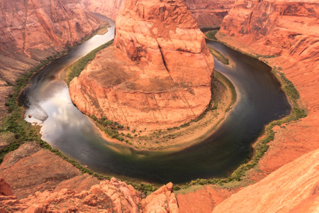 Horseshoe Bend is the name for a horseshoe-shaped meander of the Colorado River located near the town of Page, Arizona and within Glen Canyon National Recreation Area.の写真素材