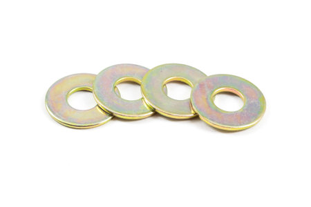 Four round metal pieces with a hole in the middle. They are all the same size and color