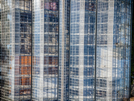 Building with many windows and a clear glass facade. The building is tall and has a modern design