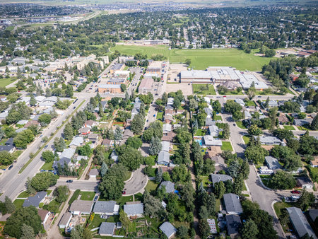Drone aerial of Greystone Heights, a residential neighbourhood in Saskatoon, Saskatchewan. The photo captures single-family homes, schools, and green spaces within a mature suburban setting close to the University of Saskatchewan.の写真素材