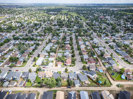 Aerial view of Kensington in Saskatoon, Saskatchewan, showing new homes, ponds, and community parks.の写真素材