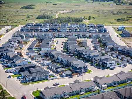 High-resolution aerial view of Martensville, a growing city just north of Saskatoon, Saskatchewan. The photo highlights residential neighbourhoods, schools, parks, and surrounding prairie landscape.の写真素材