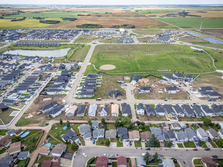 Aerial view of Kensington in Saskatoon, Saskatchewan, showing new homes, ponds, and community parks.の写真素材