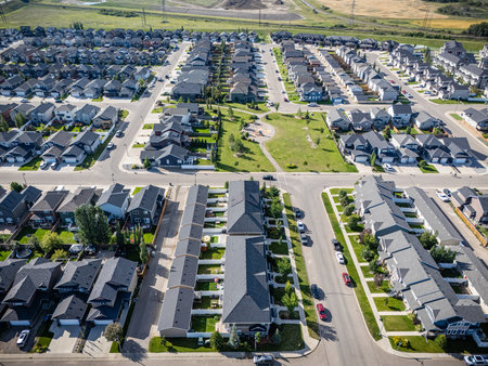 Aerial view of Stonebridge in Saskatoon, Saskatchewan, featuring modern homes, parks, and commercial areas.の写真素材