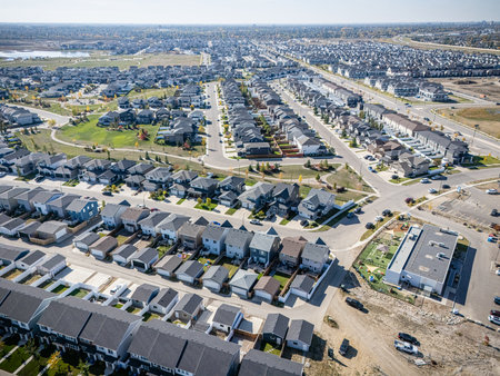 Aerial view of Saskatoon, Saskatchewan, showing colorful autumn trees, homes, and ponds.の写真素材