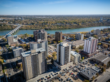Aerial view of downtown Saskatoon, Saskatchewan, with fall colors along the South Saskatchewan River.の写真素材
