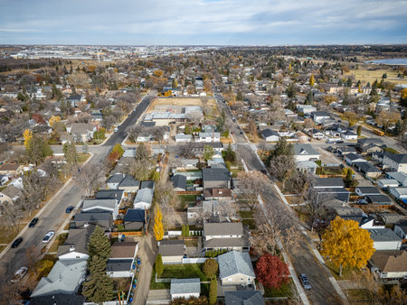Aerial view of North Park in Saskatoon, Saskatchewan, with colorful fall trees and nearby river scenery.の写真素材