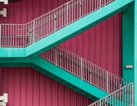 Pink wall with green stairsの写真素材