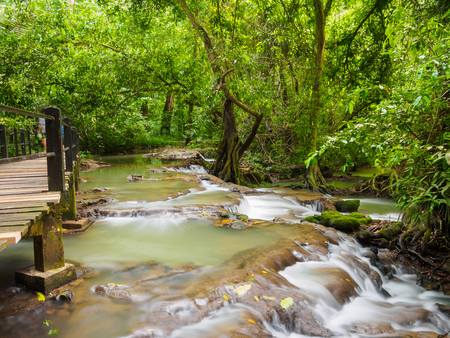 waterfall and Wooden bridge at Than Bok Khorani National Park Krabi Thailandの写真素材