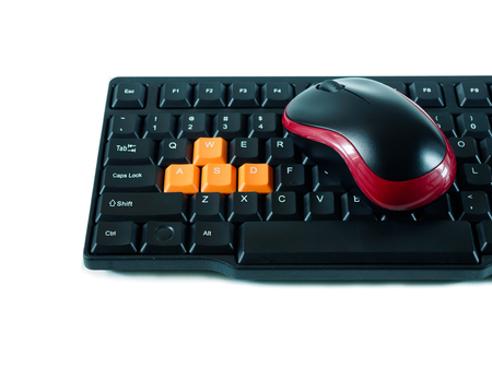 Computer black red mouse and black orange keyboard on white backgroundの写真素材