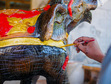 Hand of artist painting asia elephantの写真素材