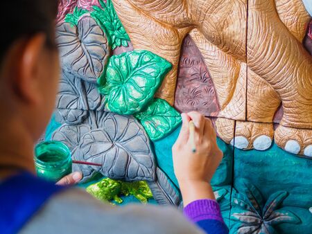 Hand of artist painting asia elephantの写真素材