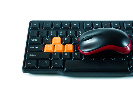 Computer black red mouse and black orange keyboard on white backgroundの写真素材
