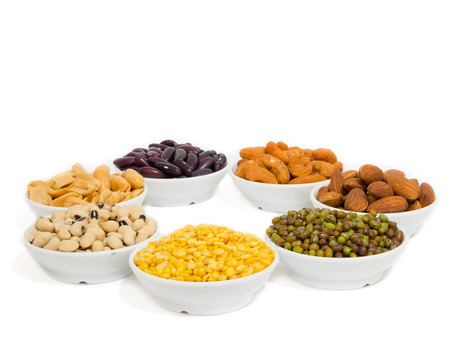 Almond, Cashew nuts, yellow bean, green bean, rice, fettucine, all put on small white cup and on white backgroundの写真素材
