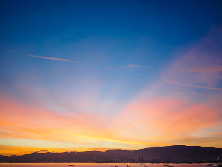 Sunset on Penang island city. Beautiful landscape with dark blue and yellow sky.の写真素材