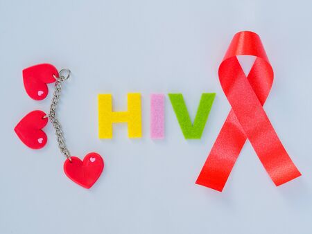 World AIDS day concept. hearts with red ribbon and HIV textの写真素材