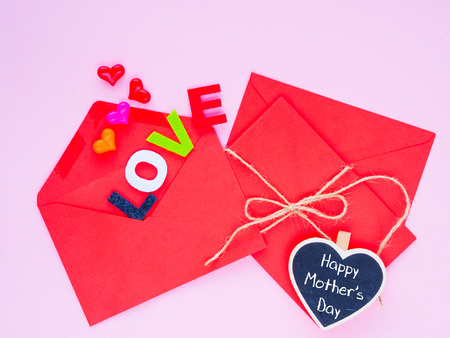 Happy Mother's day love letter concept. Opened envelope and many felt hearts. colorful of hearts...