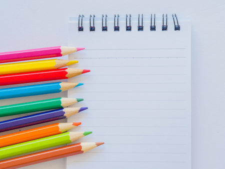 Color pencils on white paper. Education material back to school, for background and wallpaper.の写真素材