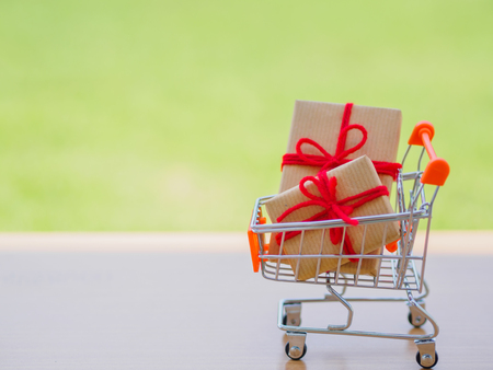 Celebration concept. Many New Year and Christmas presents or gifts represented in shopping cartの写真素材
