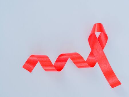 World AIDS day concept. red ribbon on white paperの写真素材