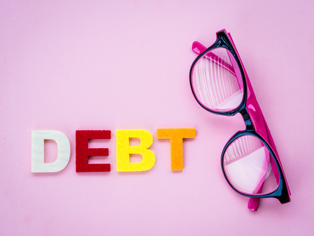 cut dept concept with text, pink glasses and scissorの写真素材