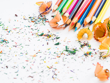 Soft focus colorful pencils with colorful pencil shavings on white background. Back to school concept.の写真素材