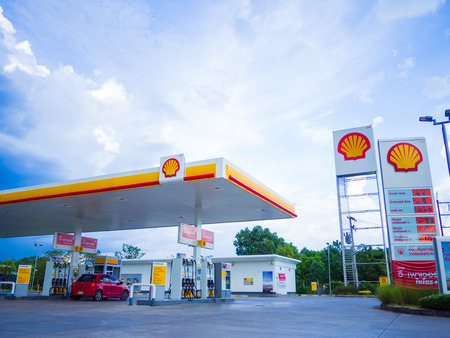 Nakhon Si Thammarat, Thailand - July 2, 2017: Shell gas station blue sky background. Royal Dutch Shell sold its Australian Shell retail operations to Dutch company Vitol in 2014のeditorial素材