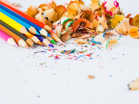 Colorful pencils with colorful pencil shavings on white background. Back to school concept.の写真素材