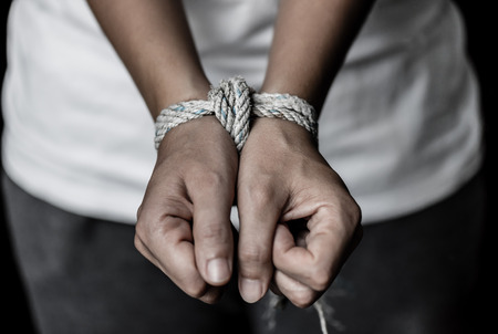 Stop violence against women, hands were tied with a rope. Violence, Terrified, Human Rights Day concept.の写真素材