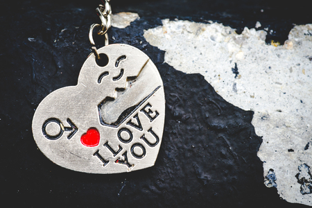 Abstrack red heart and  I LOVE YOU key chain on dark background. Love, person and valentine concept.の写真素材