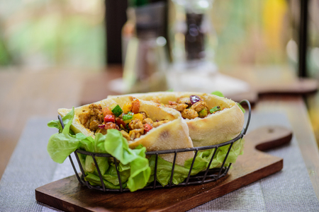 Pork and Chicken Curry Roti naan bread wraps at indian food restaurant.の写真素材