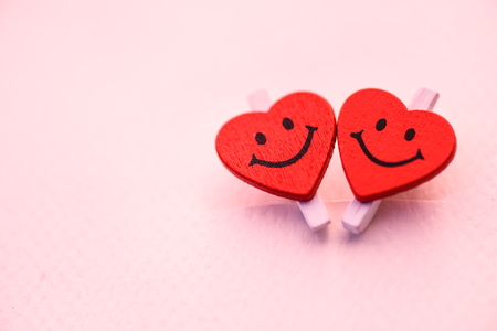 Two red heart with smile emotion. Love and Valentines day concept.の写真素材