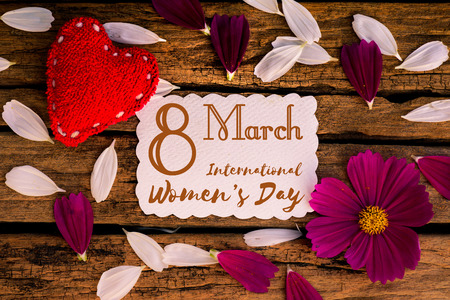 8 March Happy International Women's Day message on wooden background with handmade red heart and...