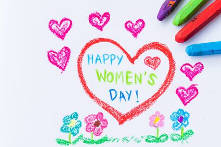 Pencil color drawing Happy Women's Day on white paper with paper star. Womens Day concept.の写真素材