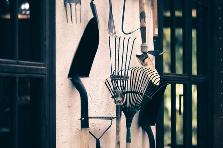 Gardening tools and equipments set on the wall at corner room, shovel, gardening concept.の写真素材