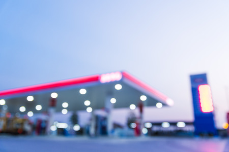 Abstract blurred of gas station or petrol station with dark blue sky during twilight time.の写真素材