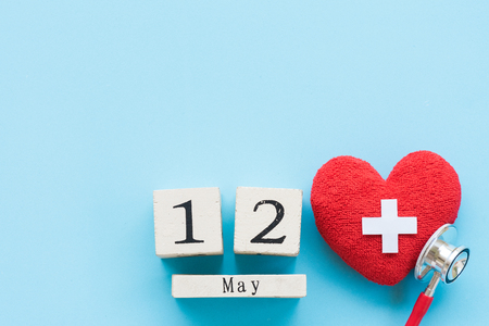 International Nurses Day, May 12. Healthcare and medical concept. Handmade Red heart with...