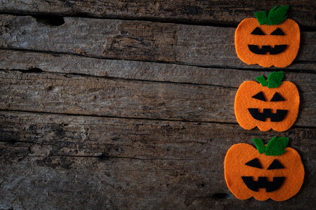 Top view of Halloween crafts, orange pumpkin on wooden background with copy space for text. halloween concept.の写真素材