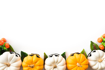 Top view of white and yellow ghost pumpkins on white background. halloween concept.の写真素材