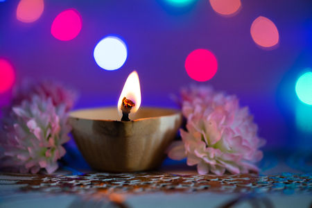 Happy Diwali - Clay Diya lamps lit during Dipavali, Hindu festival of lights celebrationの写真素材