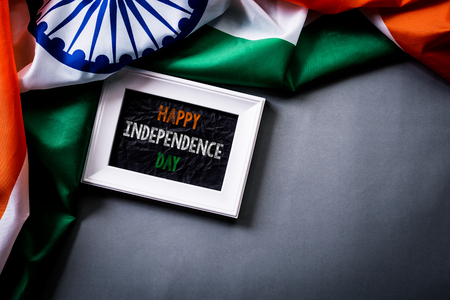 Top view of picture frame with National Flag of India on gray background. Indian Independence Day.の写真素材