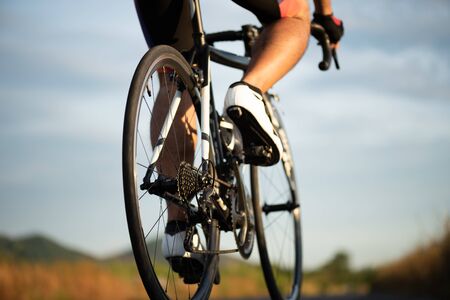 Soft focus of man cycling road bike in the morning. Sports and outdoor activities concept.