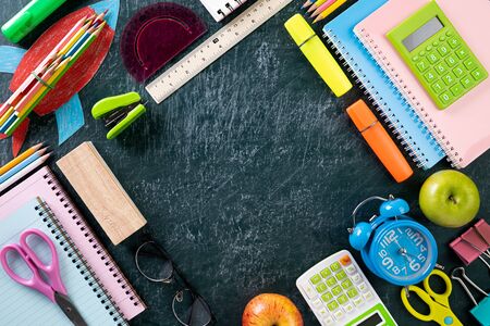 Education or back to school Concept. Top view of Colorful school supplies with books, color pencils,...